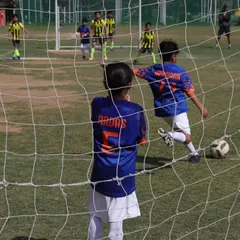 The view from behind the net as our player moves in for a shot. A crucial moment in the Gurgaon Youth League.