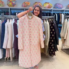 This light pink and ivory patterned sherwani is a great choice for a day wedding or a pre-wedding function. The subtle colors and elegant pattern offer a fresh, modern take on traditional wear.