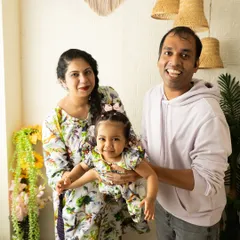 A playful family portrait that captures the energy and happiness of the moment. My goal is to create a relaxed environment where families can be themselves, resulting in authentic photographs.