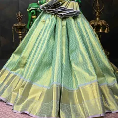 A pastel green Kanjivaram silk saree with a subtle chevron weave and a silver border. This is a sophisticated and modern take on the classic Kanjivaram.