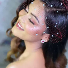 A close-up of the polo look, showing the faux freckles, glossy lips, and the crystal-studded veil.