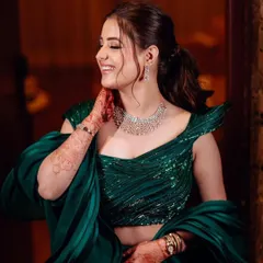The bride's joyful smile says it all. This candid shot captures the happiness and confidence that comes with wearing a perfectly styled outfit.