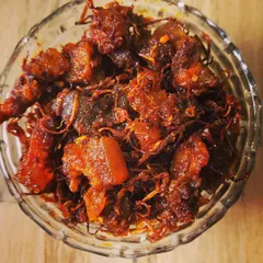 Another shot of my popular homemade pork pickle. You can see the rich red colour from the chillies and spices, promising a burst of authentic Naga flavour in every bite.