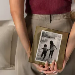 Some memories deserve more than just a place in your heart, they deserve a beautiful frame. This simple, elegant brass frame is perfect for showcasing a treasured black and white photograph.