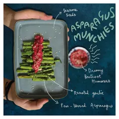 A simple yet elegant snack of pan-tossed garlic asparagus topped with my Dreamy Beetroot Hummus. This shows how my protein-packed dips can elevate even the simplest vegetables.