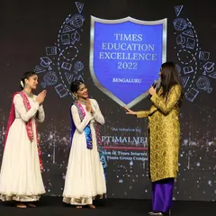 Interacting with the host on stage at the Times Education Excellence awards. Performing at such prestigious corporate events allows us to share our art with a diverse audience.