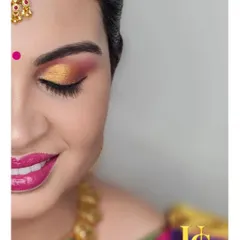 A close-up of the colorful eye makeup for a naming ceremony. In my classes, we break down how to blend multiple eyeshadow shades for a professional finish.