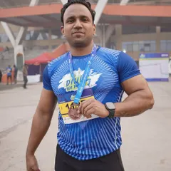 One of our dedicated members proudly showing off his medal after completing the Dilli 10K run. We train for goals both inside and outside the gym.