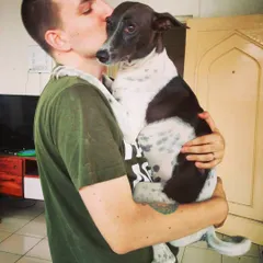 This is the lovely Luna getting a kiss from her dad. She's a fast runner who gives the best three-second hugs. I even customize her meals to make sure there are no peas, just the way she likes it.