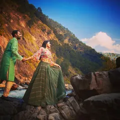 Capturing a grand, wide-angle view of a couple exploring the rocky riverbanks in Uttarakhand.