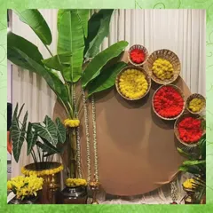 For a South Indian themed photobooth, I used a backdrop of banana leaves and baskets of red and yellow flowers. This design is a beautiful nod to tradition and creates a vibrant photo opportunity.