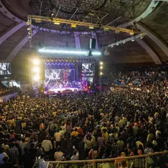 A packed stadium in Delhi during a live concert with Ayushmann Khurrana's band. Performing for thousands of people is an electrifying experience that I bring to every large-scale show.