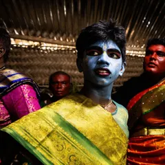 Young participants in the Kulasai festival, their painted faces and colorful sarees reflecting the vibrant energy and community spirit of the event.