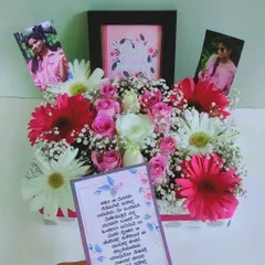 Adding a handwritten note to a floral arrangement makes it even more special. This beautiful box of flowers comes with a heartfelt message in a local language, showing love and appreciation.