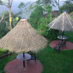A peaceful corner at one of our partner resorts in Coorg, offering a quiet space for team members to relax and reflect with a view of the lush green valley.