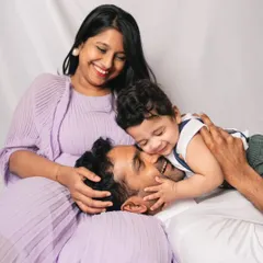Playful moments like these are my favorite to capture. This photo shows a beautiful, candid interaction between a father and his baby during a relaxed family session.