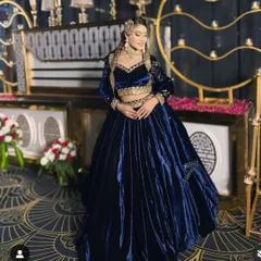 This navy blue velvet lehenga is a favorite for sangeet or reception nights. The rich fabric and gold embroidery give a very elegant and modern feel.