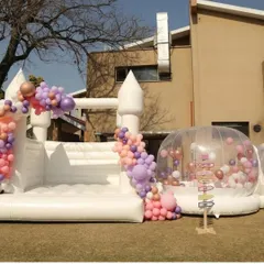 This elegant white bouncy castle and bubble house combination can be customized for any theme. For this event, we styled it for a construction-themed birthday, proving that even rugged themes can have a touch of modern fun.