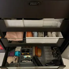 We believe every item deserves a home, which is why we create custom drawer solutions for accessories. This drawer features dedicated compartments for sunglasses, ties, and belts, all neatly arranged and easy to access.