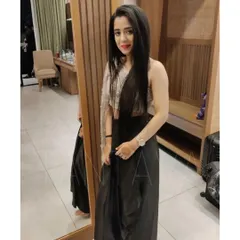 Chic and contemporary, this client is wearing a custom jet black drape skirt paired with a single-sleeve sequined crop top. It's a perfect outfit for a cocktail or sangeet night.