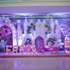 Every detail matters in creating a fairytale. For Freya's 5th birthday, I designed this enchanting Wonderland theme, complete with a custom castle backdrop, whimsical mushroom props, giant butterfly wings, and personalized light-up marquee letters.