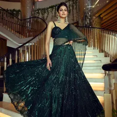A full-length shot from the G&G Magazine festive cover shoot with Manasa Varanasi. The flowing, sequined lehenga was chosen to create dramatic movement and a glamorous silhouette against the grand staircase.