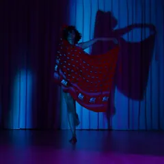 A solo exploration of movement and shadow. In these moments of practice, I experiment with form and feeling, using a simple red veil to create new stories.
