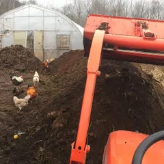 Here you can see my tractor turning a large compost pile with the chickens supervising nearby. They are always eager to get into a freshly turned pile to find insects and other treats, helping with aeration in the process.