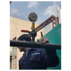 An engineer inspects a pressure gauge on a newly installed gas line. This focus on safety and quality control is paramount in every project I undertake, ensuring the system operates within precise parameters.