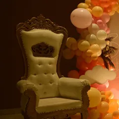 We provide elegant seating options like this high-back throne chair, which adds a touch of royalty to any baby shower and makes the mom-to-be feel extra special.