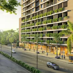 A street-level view of the North Mumbai residential project, showing the integration of retail spaces at the podium level with lush green planters.
