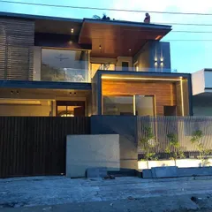 Another angle of the same Panchkula residence, showing how the lighting scheme provides a consistent and striking look from multiple viewpoints. The downlights under the roofline add depth and highlight the structure.