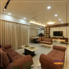 Another perspective of the living room, highlighting the spacious layout that accommodates both a seating area and the traditional swing. The design ensures the room feels open and uncluttered.