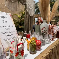 We love creating interactive experiences for guests. This DIY Mojito Bar at a bohemian-themed sundowner allowed guests to choose their own spirits, fresh fruits like kiwi and watermelon, and mixers to build their perfect drink.