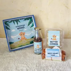 A closer look at our personalized baby announcement hamper, featuring custom labels and a selection of our most popular treats to celebrate the new arrival.