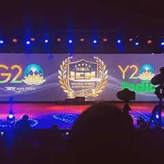 The stage for the ICN Natural Fitness & Bodybuilding competition. The extra-wide LED screen displays the event and sponsor logos, creating a professional backdrop for the championship.