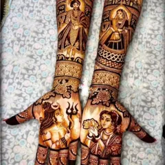 Incorporate your faith into your bridal henna. This design is a tribute to divine love, with portraits of Shiva-Parvati on the palms and Radha-Krishna on the arms, surrounded by intricate patterns.