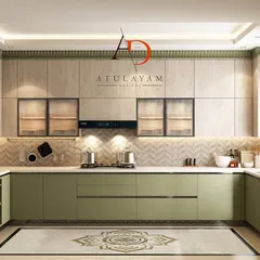This dual-tone kitchen combines earthy green handleless cabinets with wood-laminate uppers for a natural, modern aesthetic. The design includes a herringbone backsplash and a decorative floor inlay, showcasing how custom details can elevate the entire space.