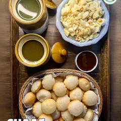 A classic Chaat platter featuring our DIY Gol Gappe set. This is a highlight of our house party menu, allowing guests to enjoy the authentic street food experience.