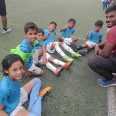 The U-7 team relaxing with their coach after a great victory. We make sure to celebrate our wins together.