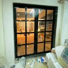 The entrance to your personal paradise. This custom-designed French door now leads to the revamped terrace in Belapur, creating a beautiful transition from the indoor living area to the outdoor lounge.
