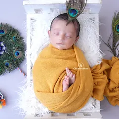 For his first Janmashtami, we celebrated this little one as our own 'Natkhat Nandlal'. I love incorporating cultural themes that are meaningful to your family, complete with details like the peacock feather.
