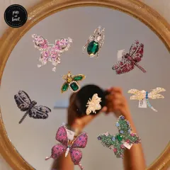 Meet the boldest brooch gang in town. This nature-inspired collection features sparkling butterflies, dragonflies, and beetles in a variety of colors and sizes. Each one is a small piece of art.