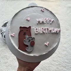 A cute bento cake with a hand-painted bear and cub. It's a sweet design for a birthday or to celebrate a special bond.