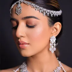 A close-up of the bride's flawless makeup and the sleekness of her hair.