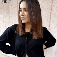 Another angle of this classic straight haircut, showing its clean lines and beautiful, subtle color.
