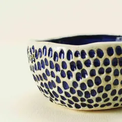 This is my 'Aqua Snack Bowl,' featuring a highly textured exterior created by pressing patterns into the clay. The inside is a smooth, brilliant indigo, creating a wonderful contrast.