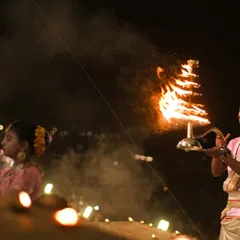The Ganga Aarti in Banaras is pure emotion. This shot focuses on a priest performing the ritual with a multi-tiered fire lamp, capturing the devotion and spiritual intensity of the ceremony.