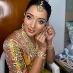 A closer look at the final touches. Her skin looks luminous and fresh, a signature of my bridal style, ensuring she looks perfect from every angle.