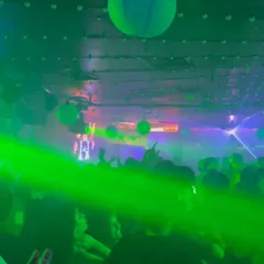 The view from my console on a Saturday night. The green laser cuts through the crowd, and everyone is lost in the music.